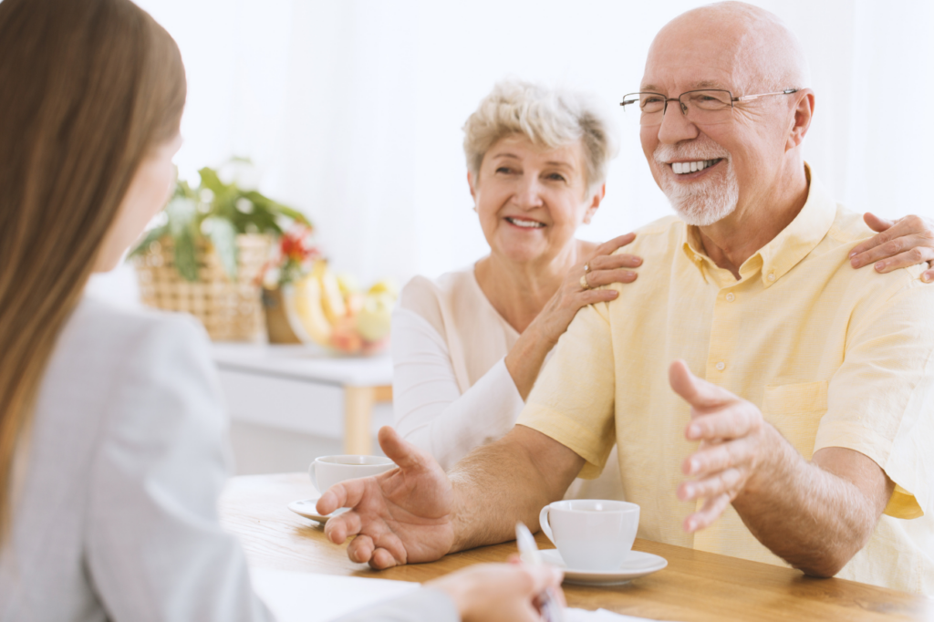Elderly couple talking to insurance agent