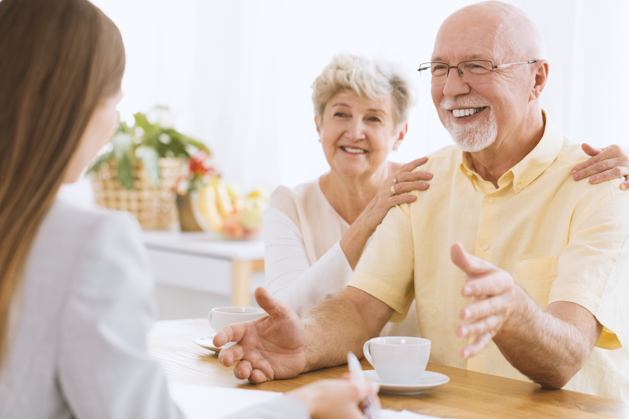 Elderly couple talking to insurance agent