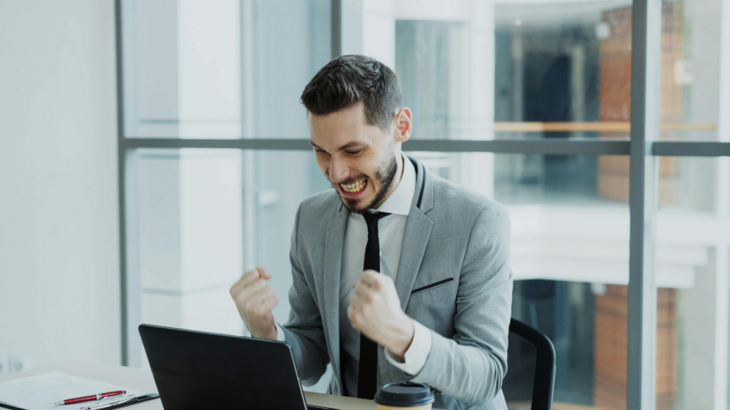 Excited Insurance Agent Celebrating Success at Work